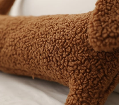 Close-up of brown boucle teddy fabric texture on cute dachshund pillow showing premium craftsmanship and ultra-soft plush material