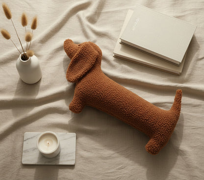 Cute animal pillow flat-lay with pampas grass and candles - brown boucle dachshund pillow for stylish home decor and interior design
